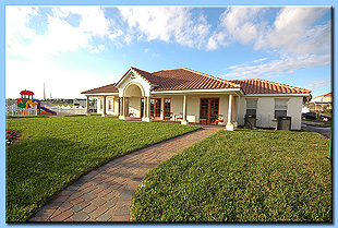 An outside view of the Tuscan Hills clubhouse.