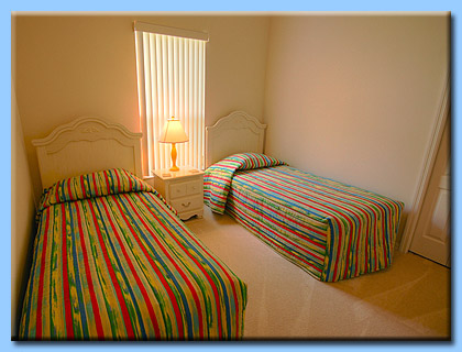 Bedroom three has two single beds.