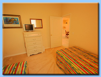 Bedroom 3 in the Villa is a twin room with flat screen T.V.