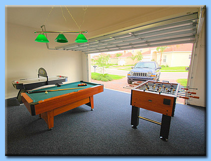 The garage door of the Villa is open and the games room has been carpeted and furnished with exciting family games.